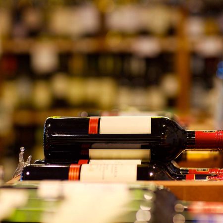 A shot of wine bottle in wine section of supermarket